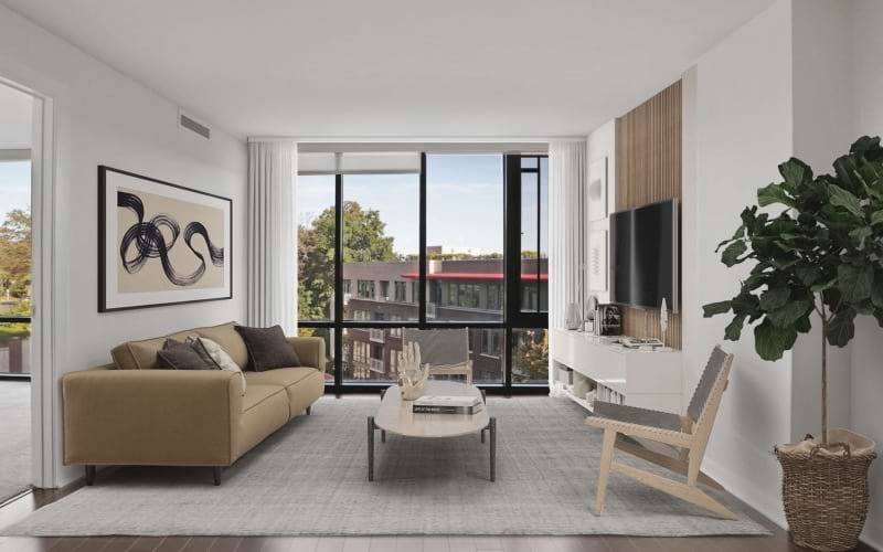 living room with floor to ceiling windows and wood flooring 